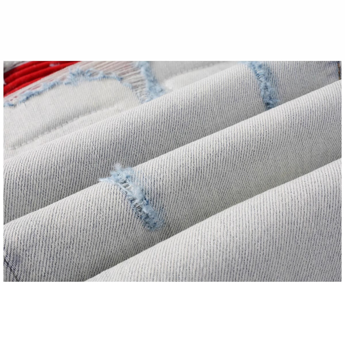 Distressed red patched jeans